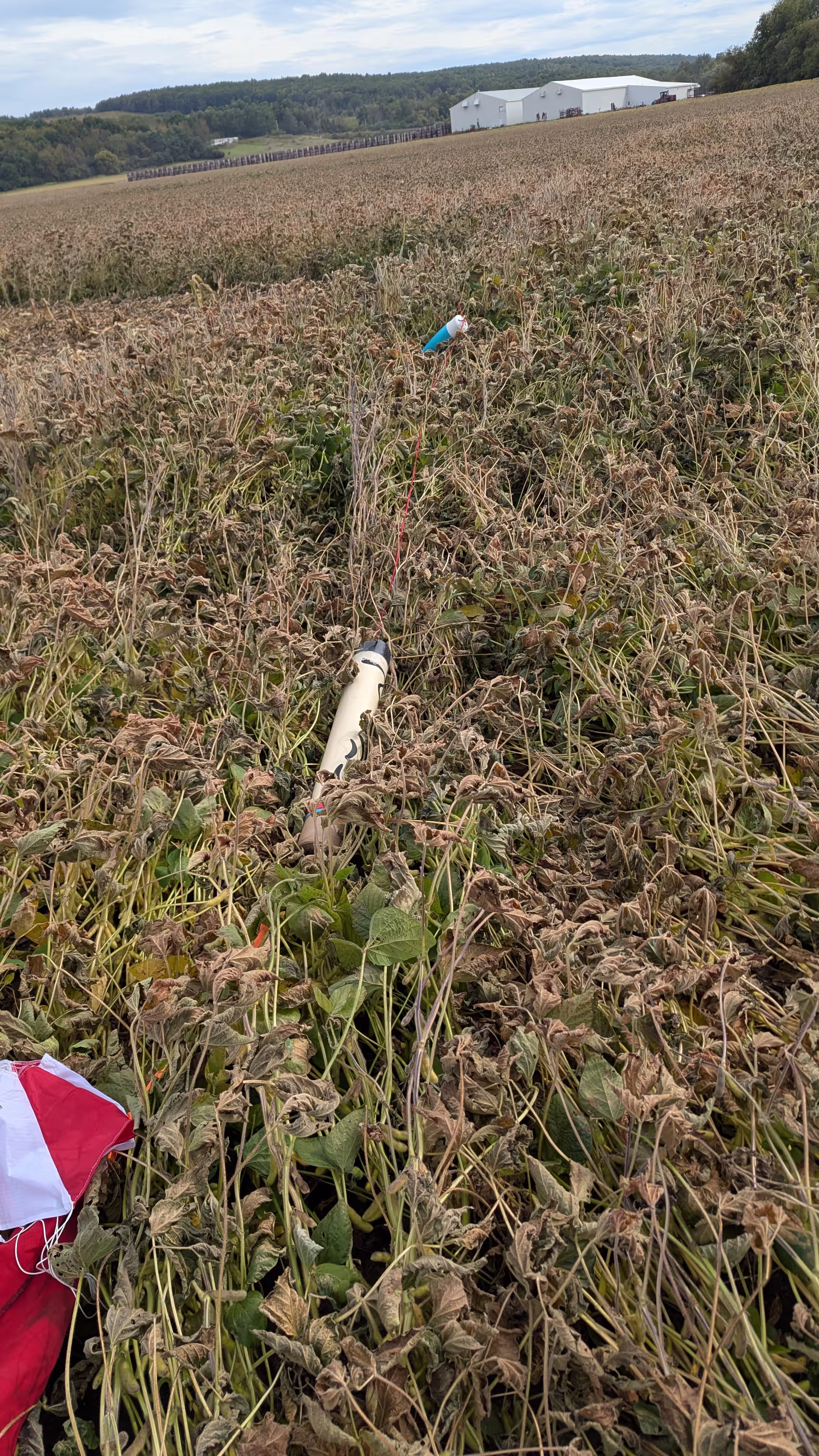 Rocket recovered in a field after landing